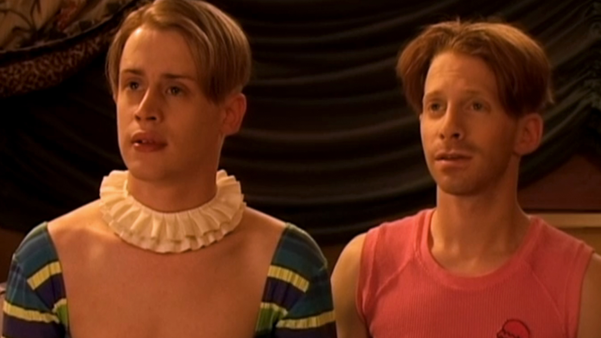 Macaulay Culkin and Seth Green standing next to each other in Party Monster.