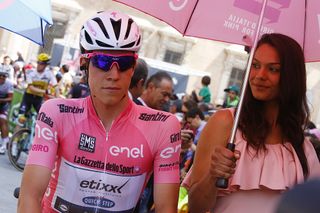 Luxembourg's rider Bob Jungels of Etixx - Quick Step wearing the Pink jersey of the overall leader, waves as he arrives to take the start of the 11th stage of the 99th Giro d'Italia