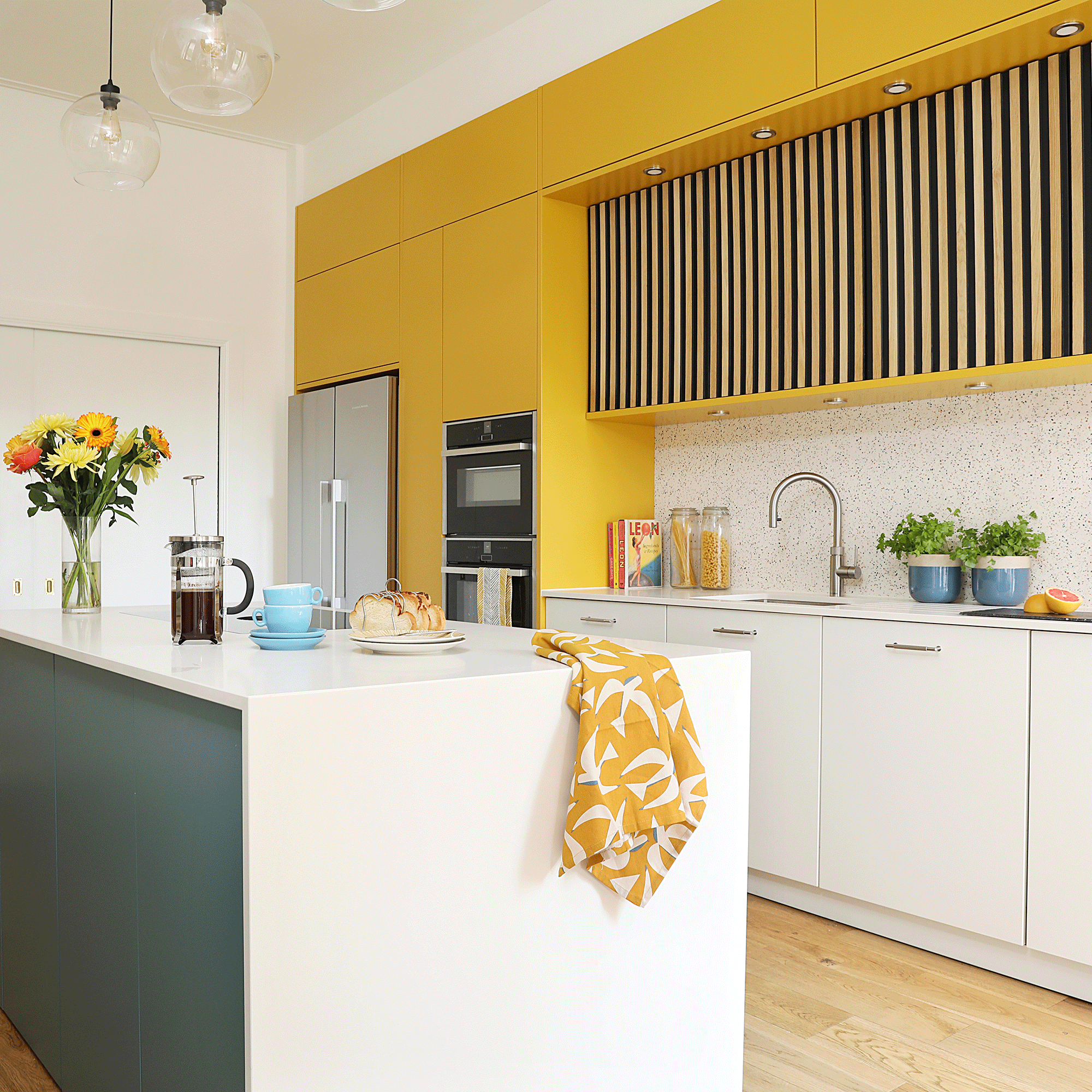 Yellow kitchen with white countertop