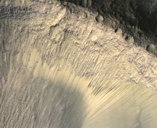 An image of recurring slope lineae on Mars, which are believed to represent the movement of briny water on the Red Planet's surface. These areas may be hospitable to microbes.