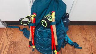 Helly Hansen Transistor packed with trekking poles attached