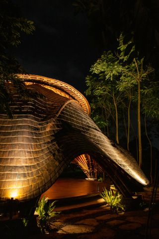 night shot of ibuku-designed alchemy yoga studio in Bali