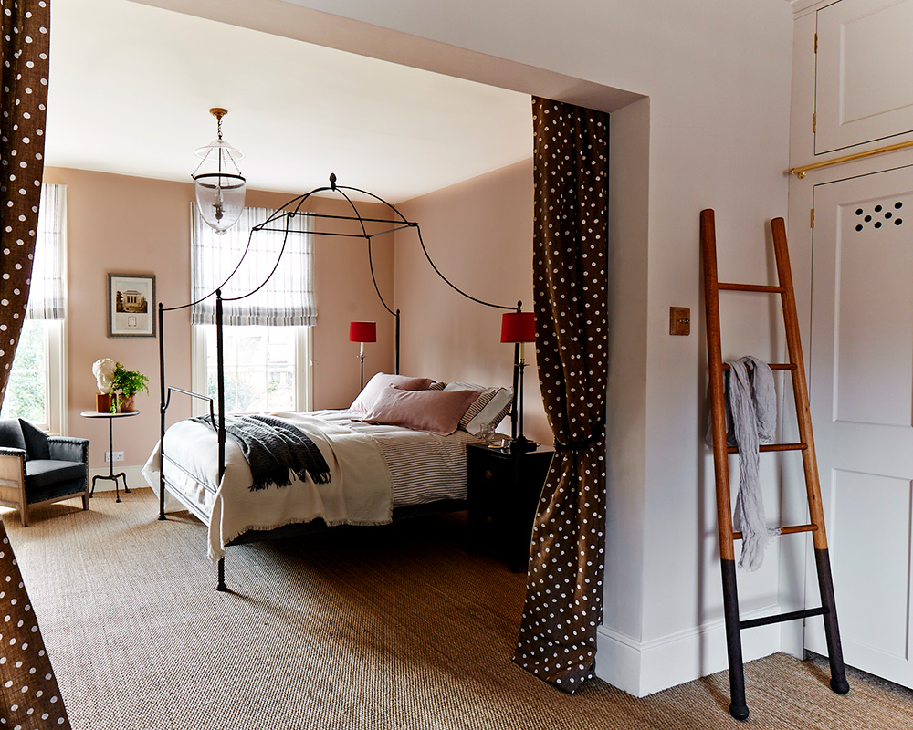 A rustic bedroom with natural flooring