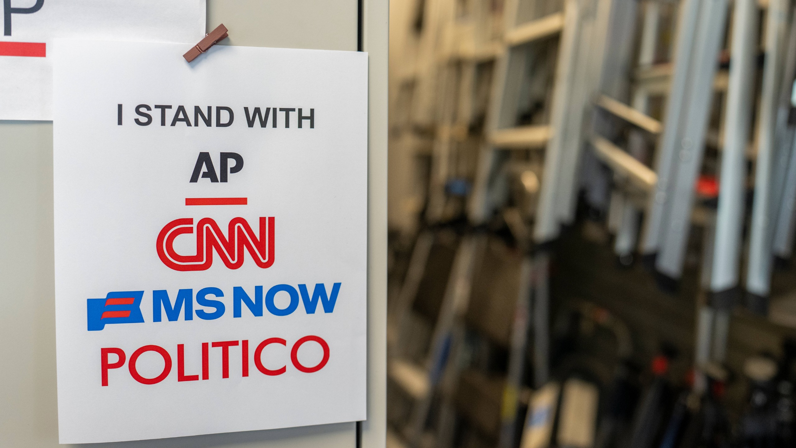 A sign in support of AP, CNN, MS NOW, and Politico near the James S. Brady Press Briefing Room of the White House in Washington, DC, US, on Monday, Sept. 21, 2026