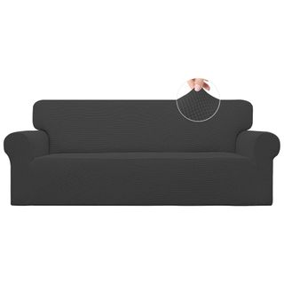 A black stretchy fitted couch cover on a classic couch