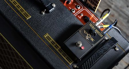 The Vox VTB-1 Treble Booster is a Rangemaster-inspired pedal that features a single chicken-head dial and a Fat switch, and has gold text on a black paint job.