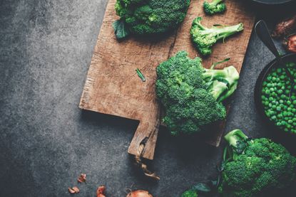 When to harvest broccoli – calabrese broccoli on a chopping board