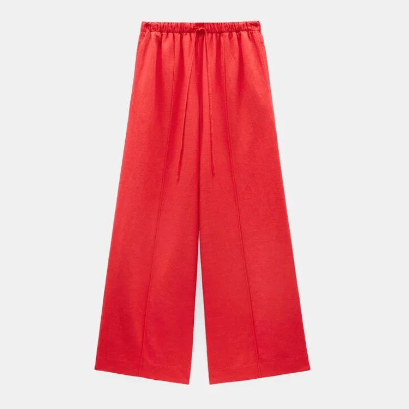 A cutout of red linen trousers by Hush