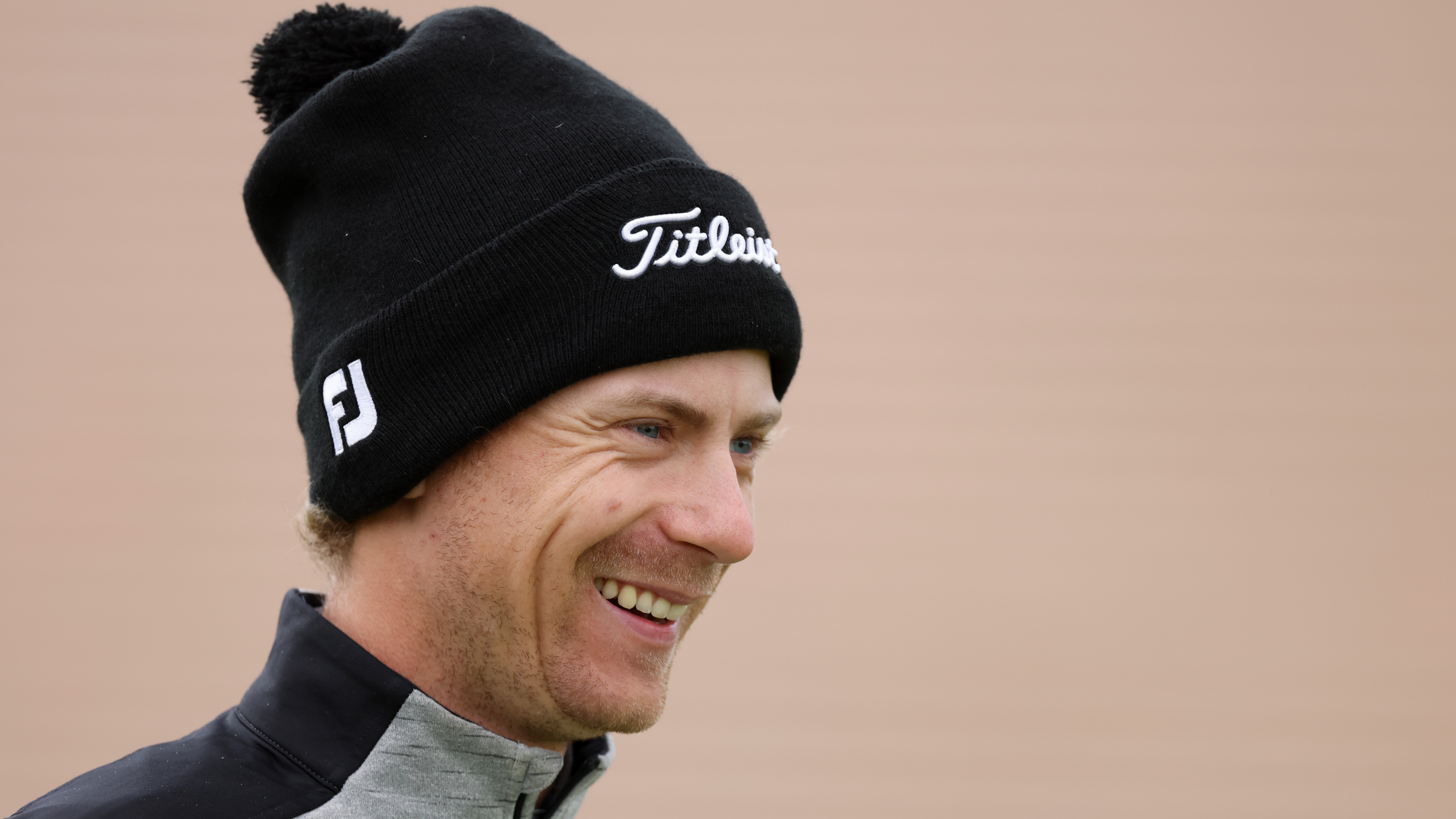John Axelsen smiling with a bobble hat on