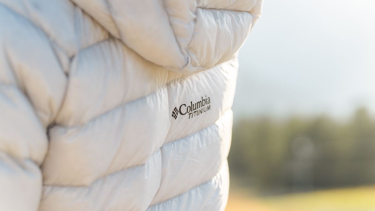 Close up of Columbia logo on white puffer jacket