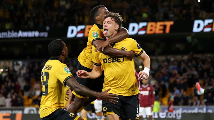 Jorgen Strand Larsen of Wolverhampton Wanderers celebrates scoring his team&#039;s third goal with teammates Jackson Tchatchoua and Jhon Arias during the Carabao Cup Second Round match between Wolverhampton Wanderers and West Ham United at Molineux on August 26, 2025 in Wolverhampton, England. 