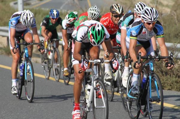 A UAE rider checks what gear he's in