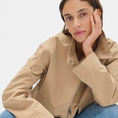 Model wears Aligne beige funnel-neck jacket