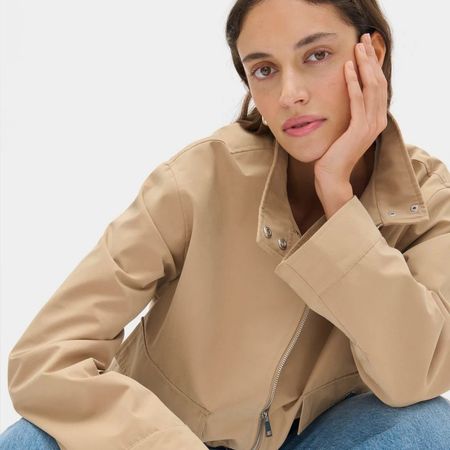 Model wears Aligne beige funnel-neck jacket