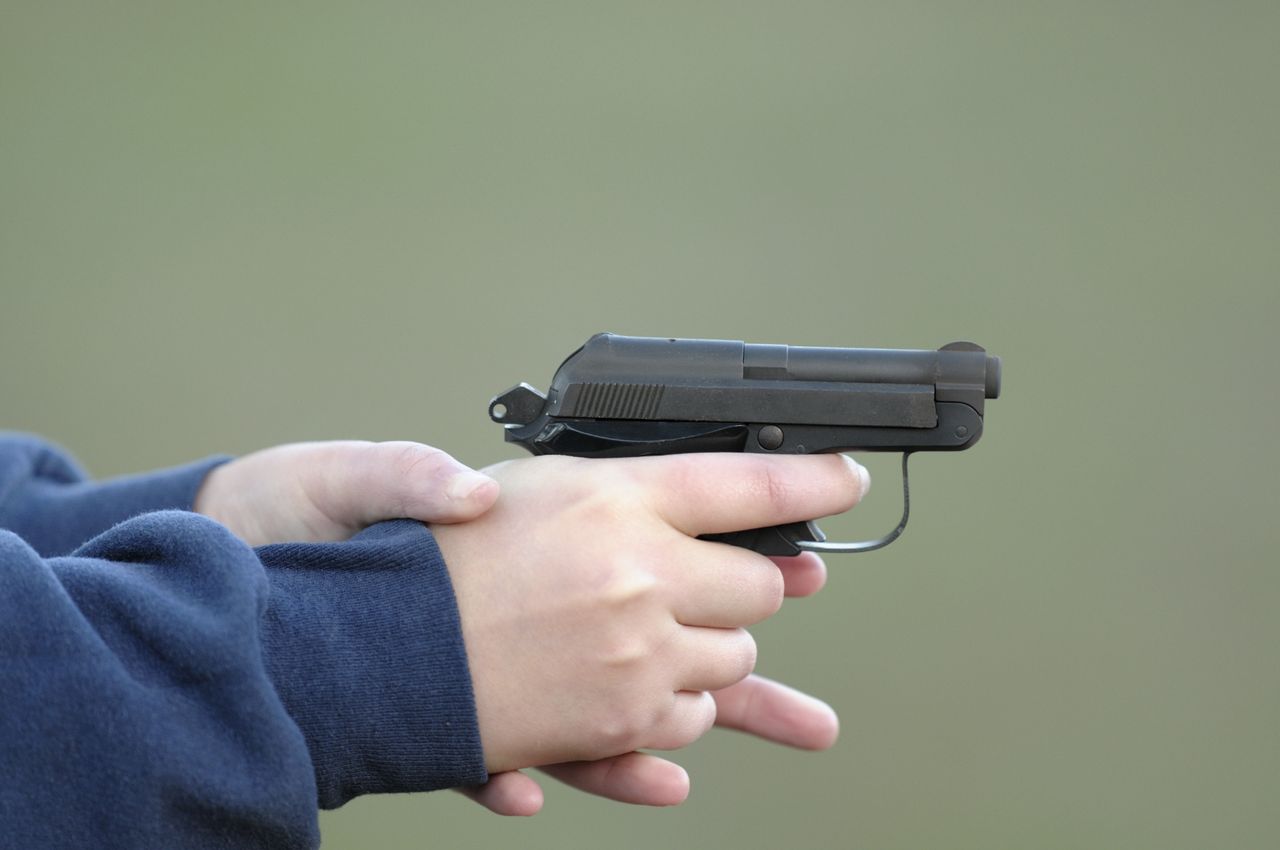 A child holding a gun