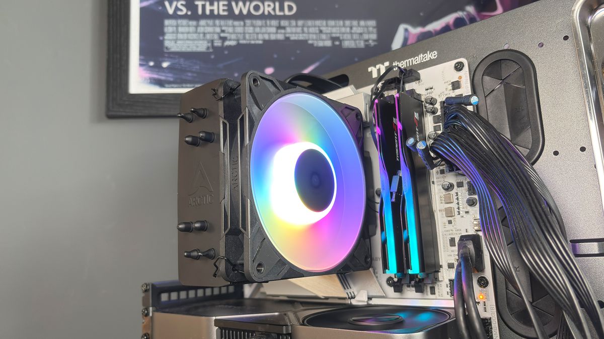 An Arctic Freezer 36-S on a desk and installed in a gaming PC, with the Freezer 36 nearby.