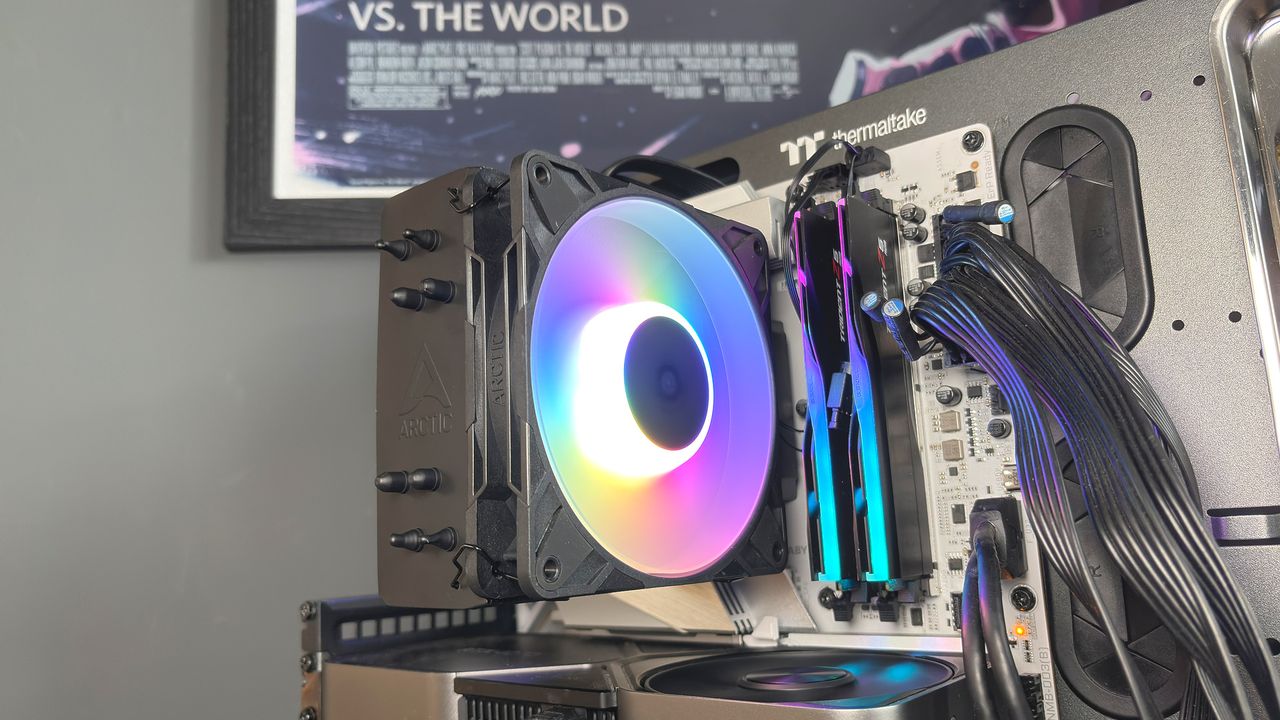 An Arctic Freezer 36-S on a desk and installed in a gaming PC, with the Freezer 36 nearby.