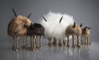 mini beasts in furs with bronze feet