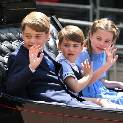 Prince George, Princess Charlotte and Prince Louis wave during Trooping the Colour