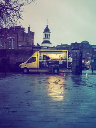 Street photograph of a parked food truck, taken on the OM System OM-3 with the OM System 25mm f/1.8 II lens