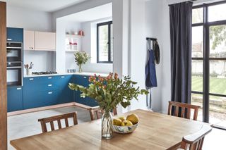 Open plan kitchen-diner with dark blue kitchen