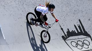 Charlotte Worthington, in a white shirt and black trousers, competing in the BMX Freestyle ahead of the 2024 Olympics Games.