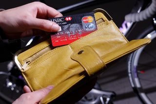Image shows a rider packing a bank card for a bike ride.