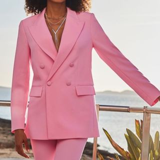 Image of woman wearing pink blazer