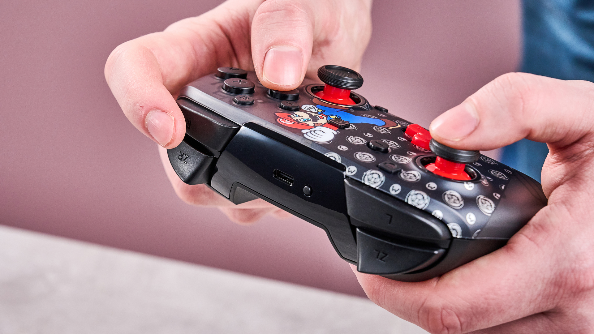 Man holding the Turtle Beach Rematch Wireless Controller for Nintendo Switch 2