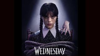 A poster for the show "Wednesday" shows the main character, with her hands tied, looking at the viewer.