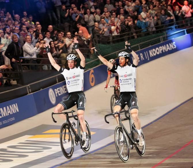 Iljo Keisse, left, and Niki Terpstra celebrate their overall victory in Rotterdam after winning the final Madison