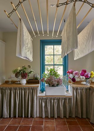 Utility room with pulley dryer and sink curtains