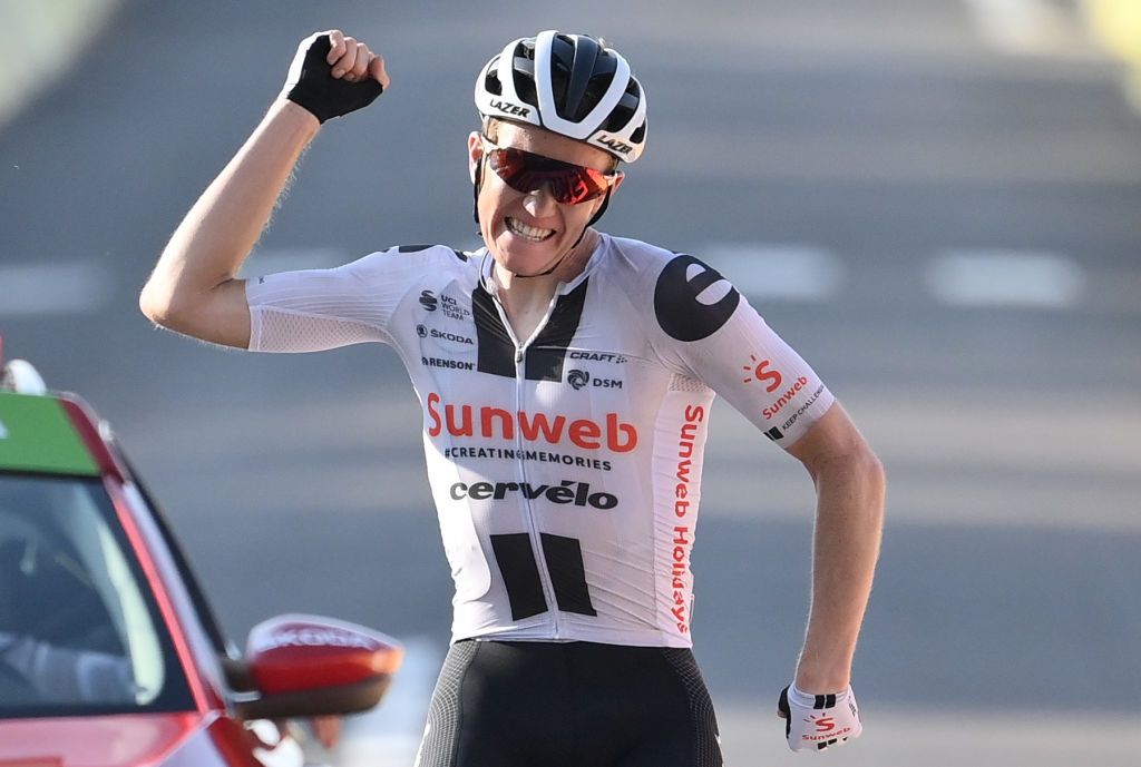 Stage winner Team Sunweb rider Denmarks Soren Kragh Andersen celebrates as he crosses the finish line at the end of the 19th stage of the 107th edition of the Tour de France cycling race 160 km between BourgenBresse and Champagnole on September 18 2020 Photo by Marco BERTORELLO POOL AFP Photo by MARCO BERTORELLOPOOLAFP via Getty Images