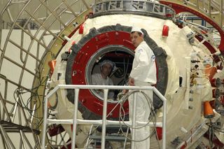 Roscosmos engineers work on assembling and testing the new Nauka module at the Baikonur Cosmodrome in Kazakhstan.