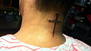 Symbolic cross tattoo