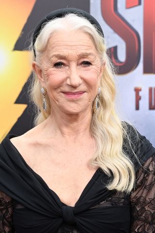 Helen Mirren is pictured with wavy hair at the Los Angeles premiere of Warner Bros.' "Shazam! Fury Of The Gods" at Regency Village Theatre on March 14, 2023 in Los Angeles, California.