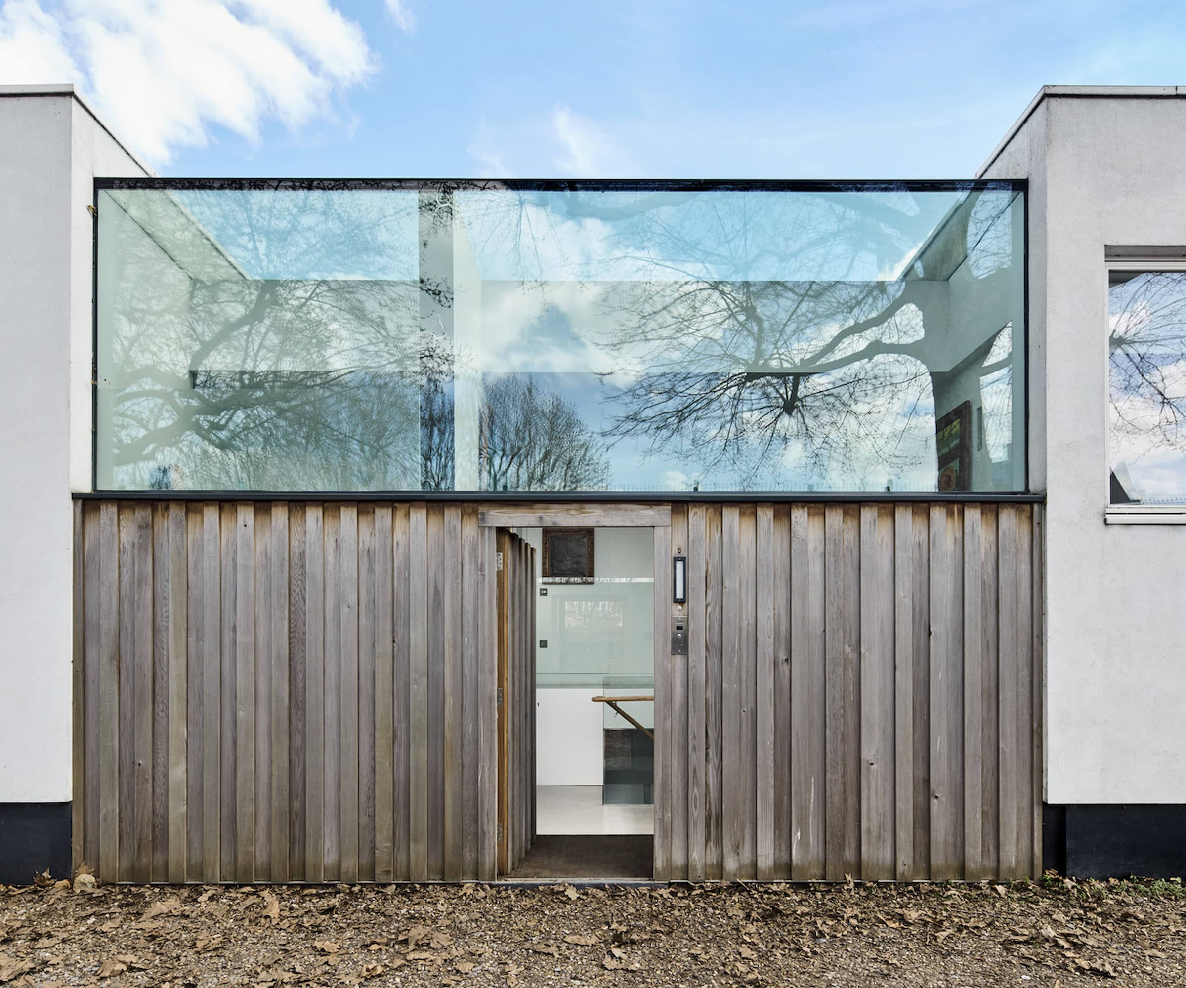 A self build with large glass and timber front