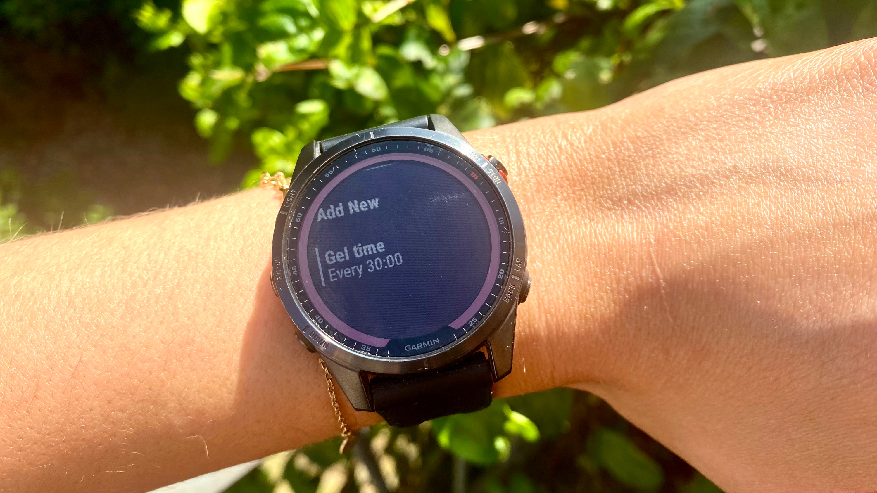 Jessica's Garmin watch shows gel alerts that she manually set on the watch