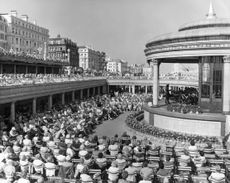 A large crowd gathers in front of the bandstand in Eastbourne in August 1972. Credit: Fox Photos/Hulton Archive via Getty Images