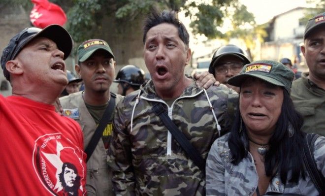 Venezuelan supporters of Hugo Chavez react in Caracas