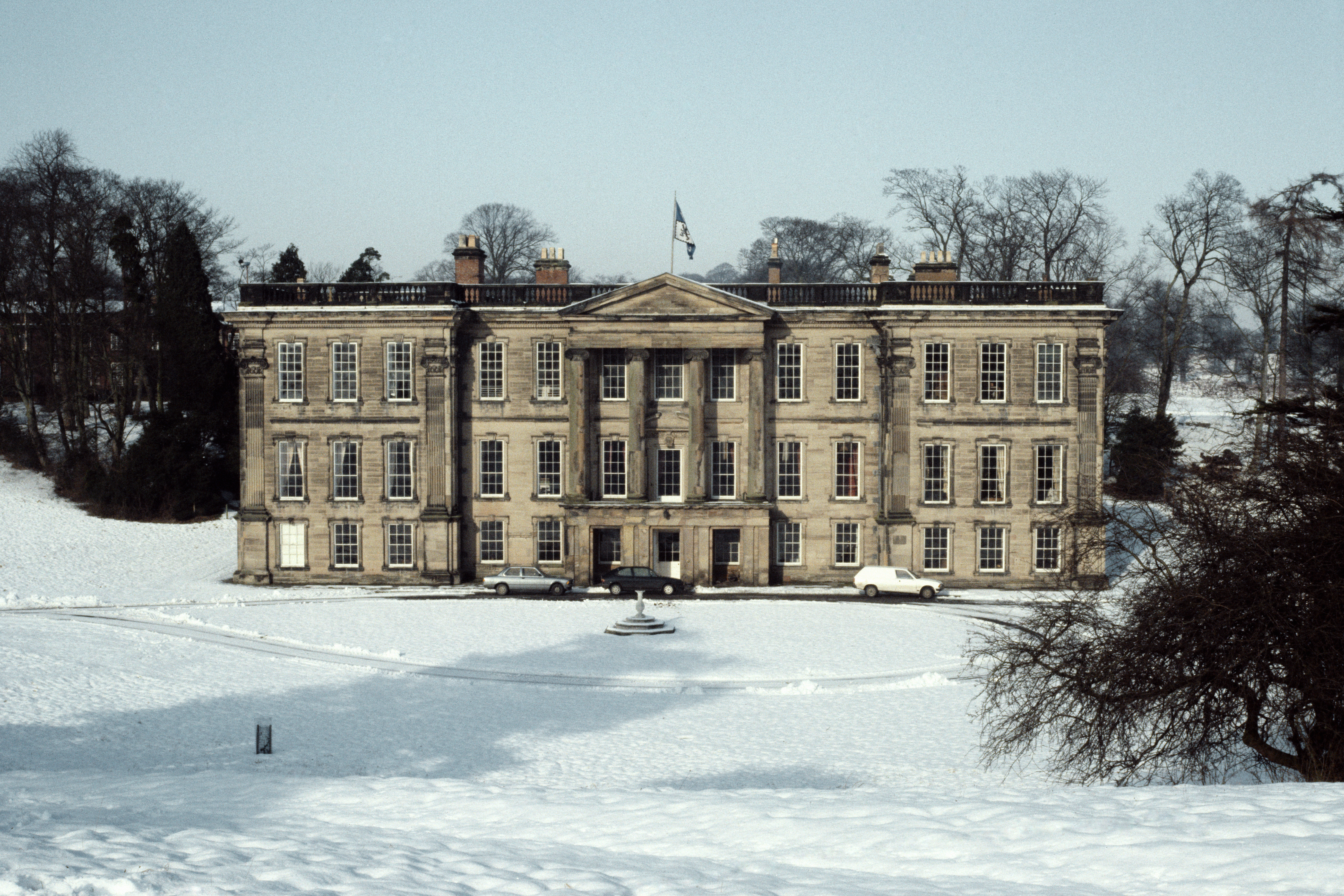 The facade of Calke Abbey in the snow
