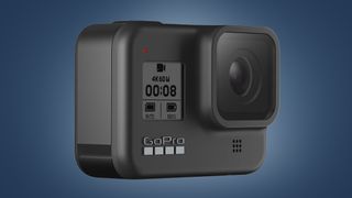 The GoPro Hero 8 Black action camera on a blue background