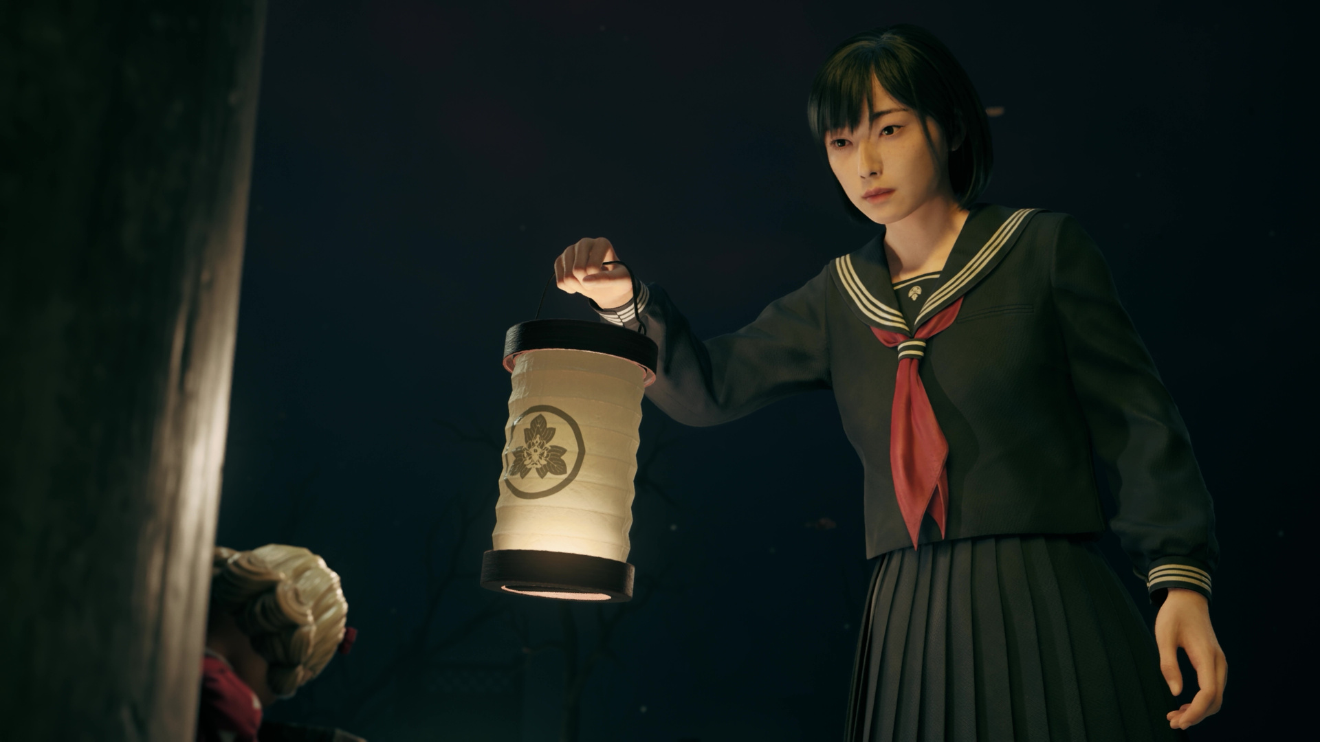 Hinako raises a lantern to look at a strange doll within the shrine world in Silent Hill f, from the Tokyo preview