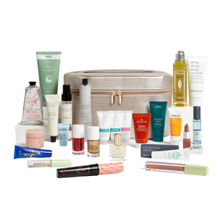 M&S beauty advent calendar with products laid out in front of silver carry bag