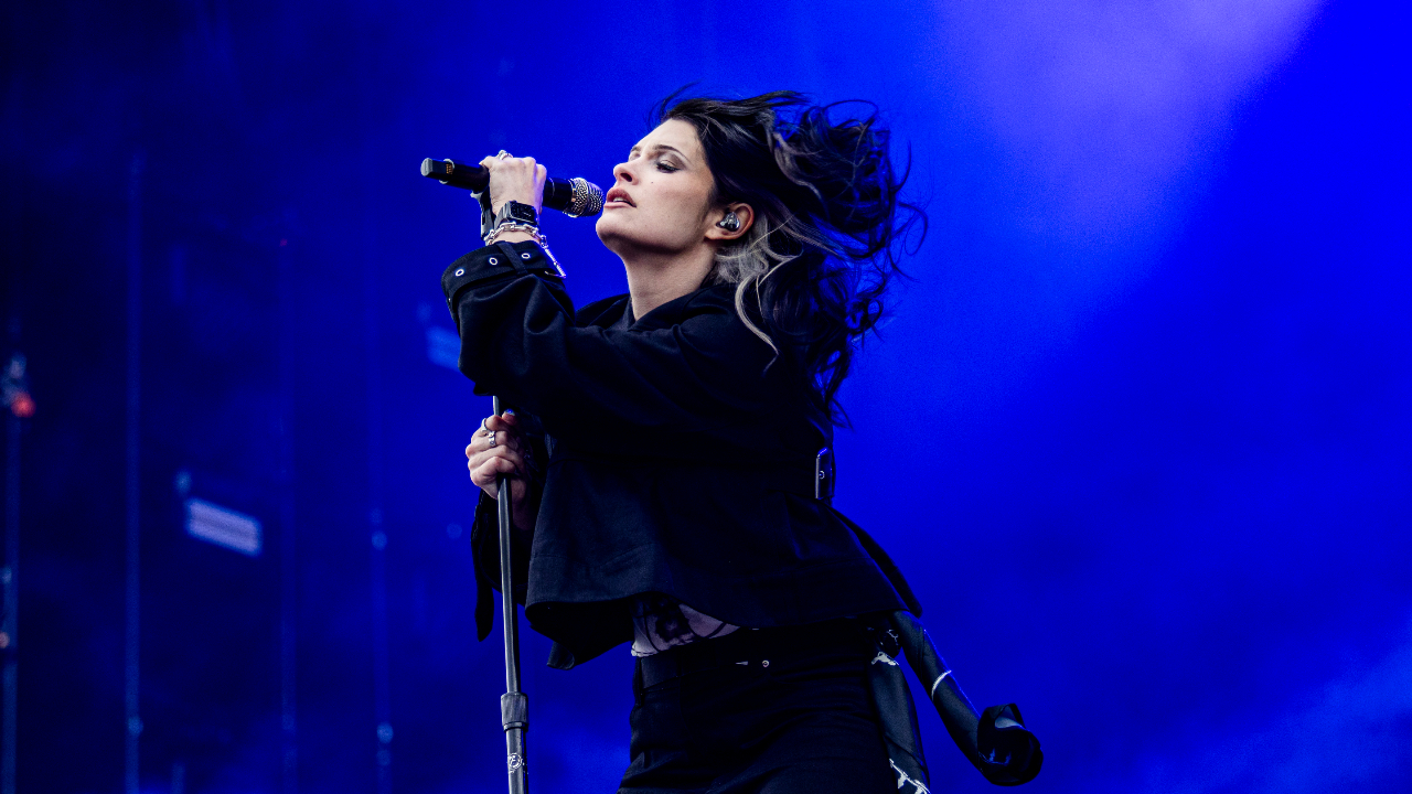 Courtney LaPlante singing on stage