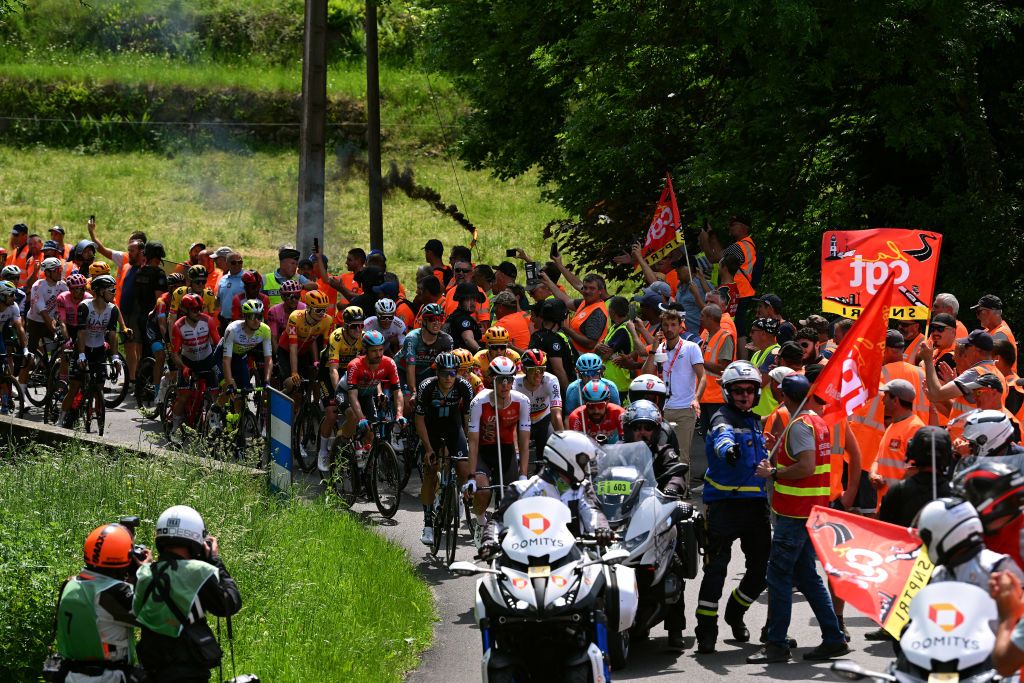 LE COTEAU FRANCE JUNE 06 Protesters block the road in Marols village during the 75th Criterium du Dauphine 2023 Stage 3 a 1941km stage from MonistrolsurLoire to Le Coteau UCIWT on June 06 2023 in Le Coteau France Photo by Dario BelingheriGetty Images