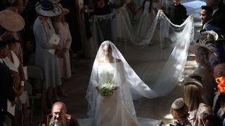 Meghan walking down the aisle alone at her 2018 wedding