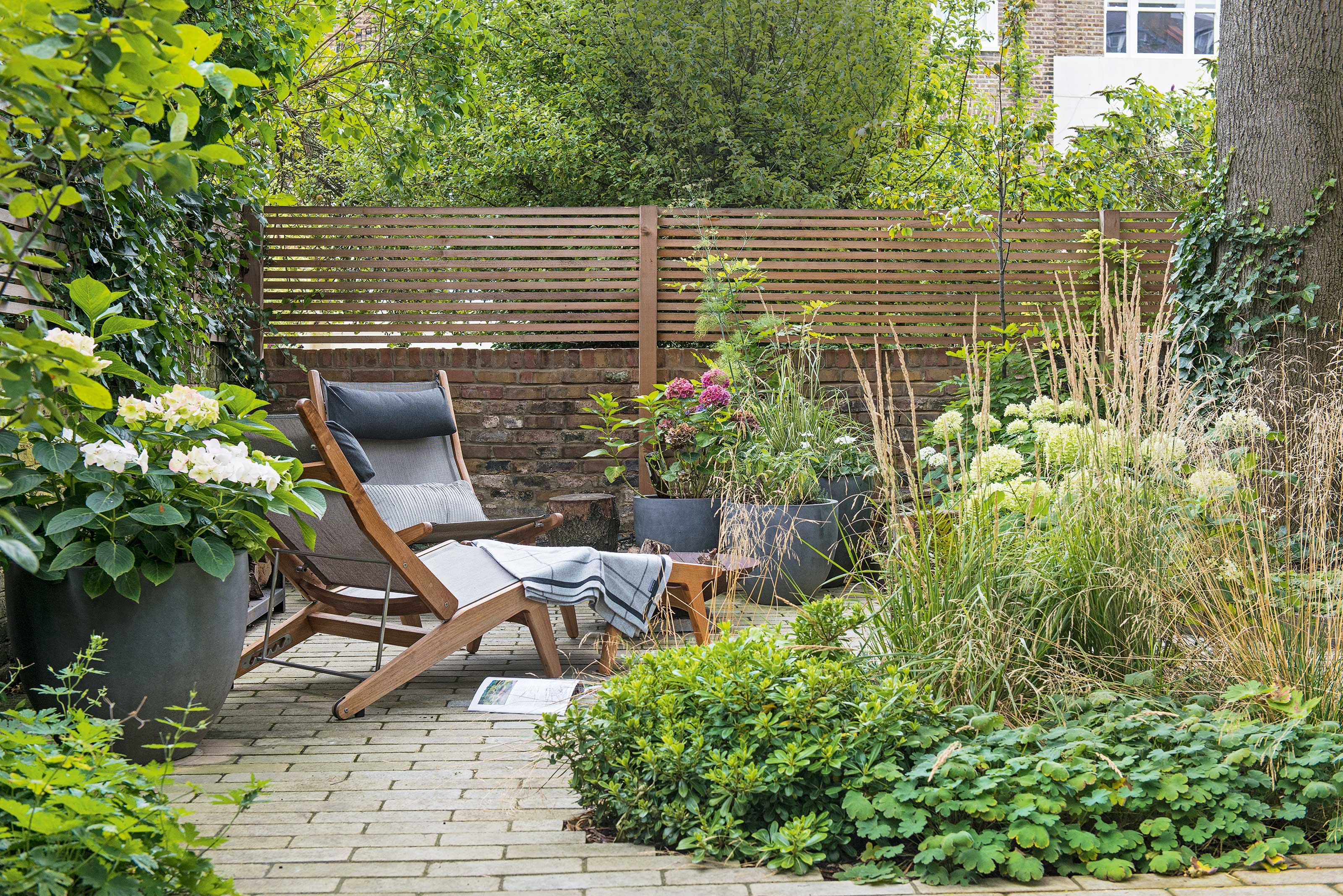 relaxed patio area with privacy wall and fence