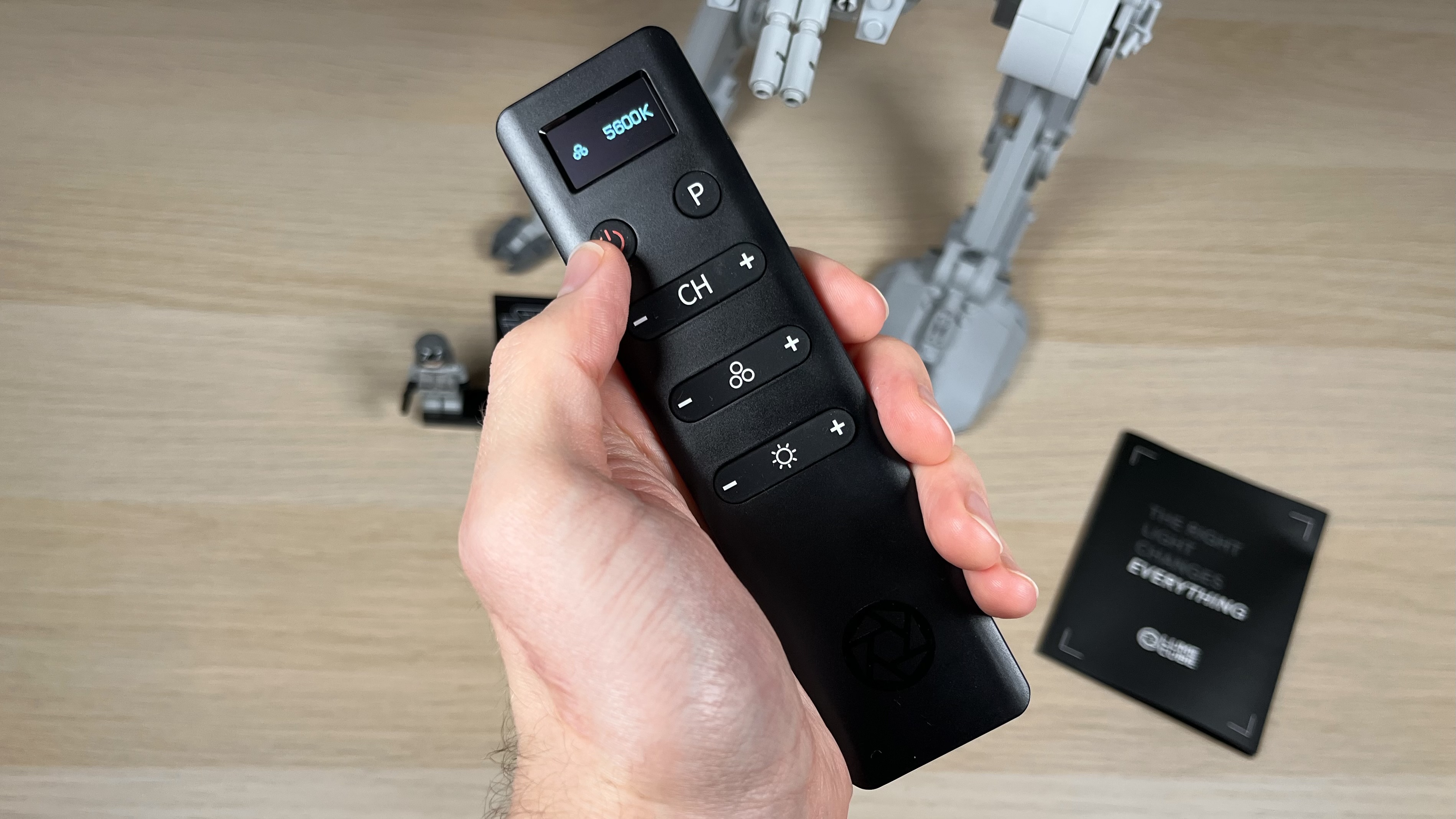 Lume Cube Studio Panel Lighting Kit, hand holding remote control