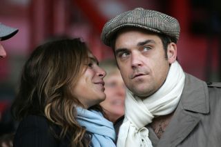 Robbie Williams and his wife Ayda Field watch Port Vale against Brentford in 2009.
